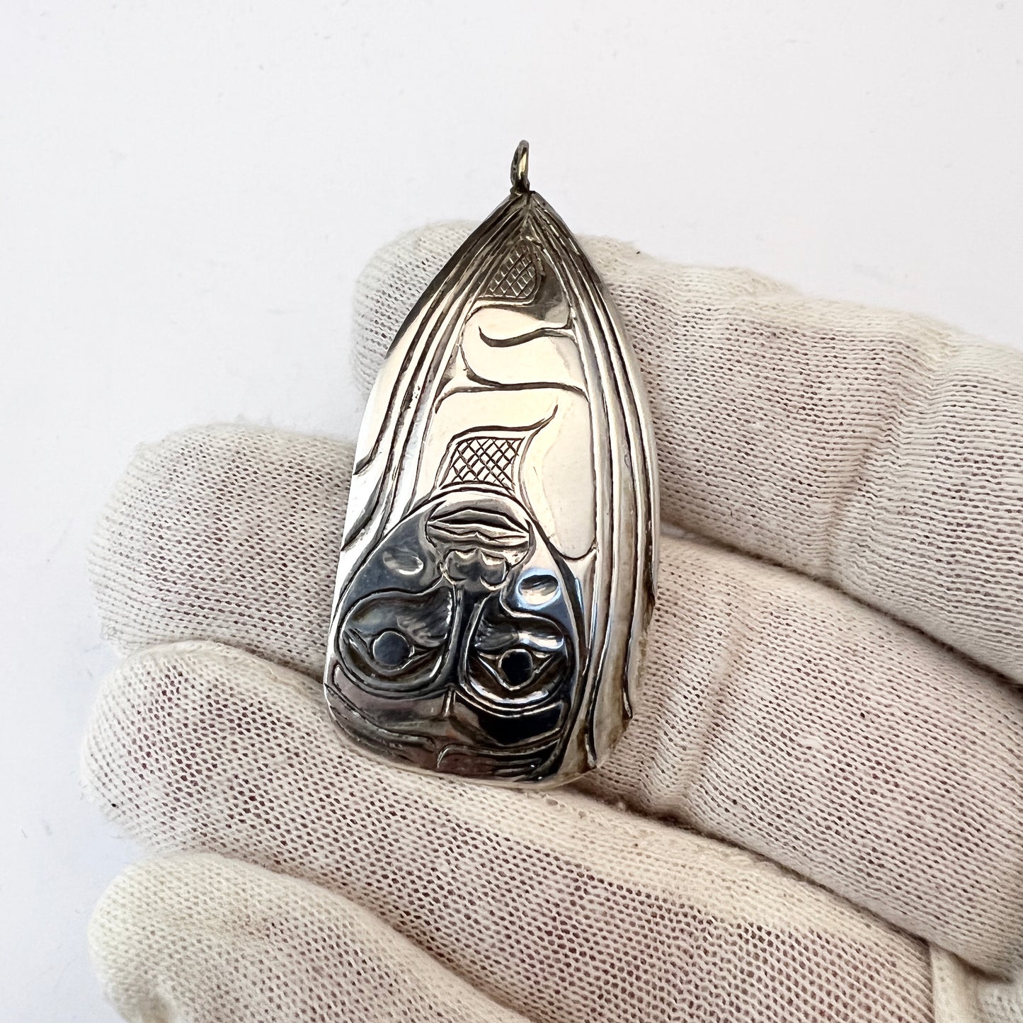 Maker W.P, Haida Canada 1987. Vintage Sterling Raven & Human Pendant.