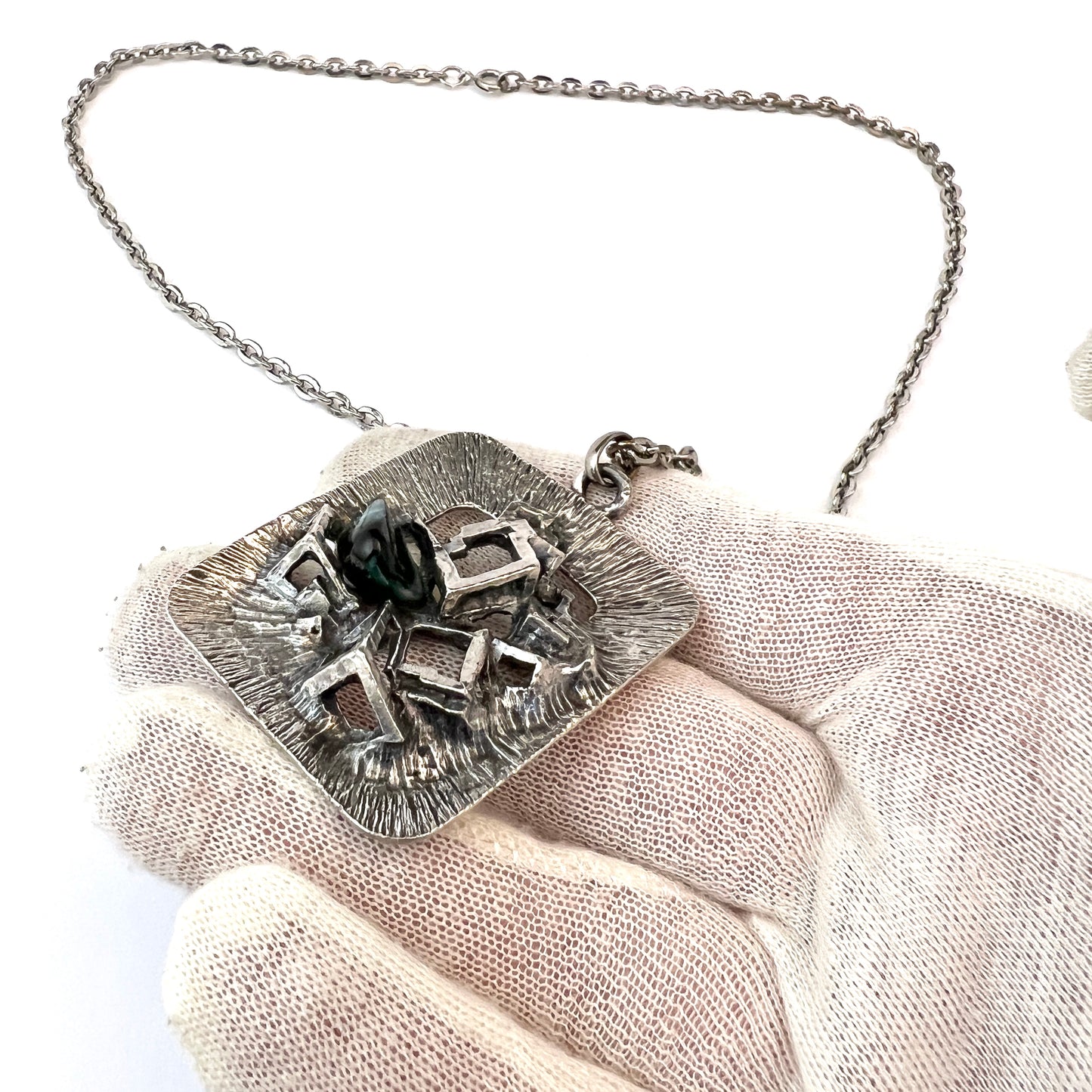 Scandinavia 1970s. Bold Vintage 1970s White Metal Green Glass Modernist Pendant Necklace.