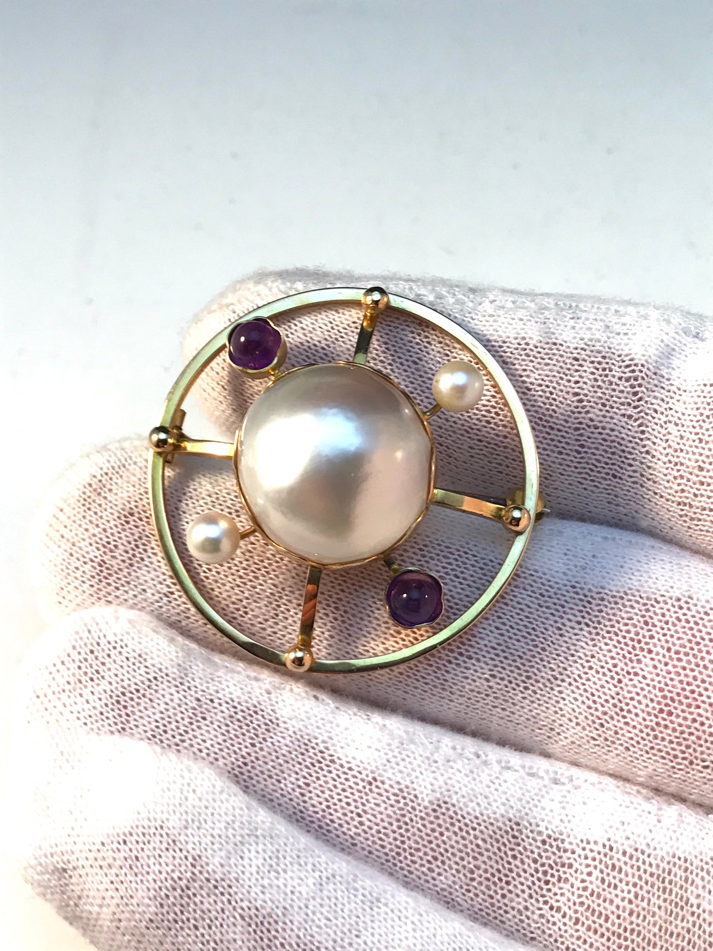 Örnsköldsvik, Sweden Year 1947 Mid Century 18k Gold Large Mabe Pearl Amethyst Brooch.