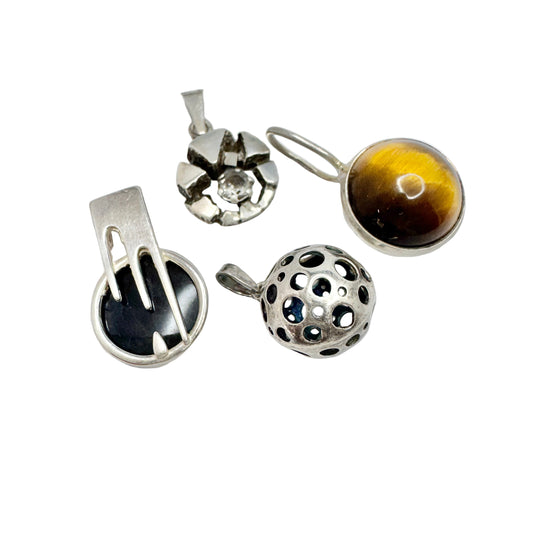 Finland. Four Small Vintage Solid Silver Pendants.