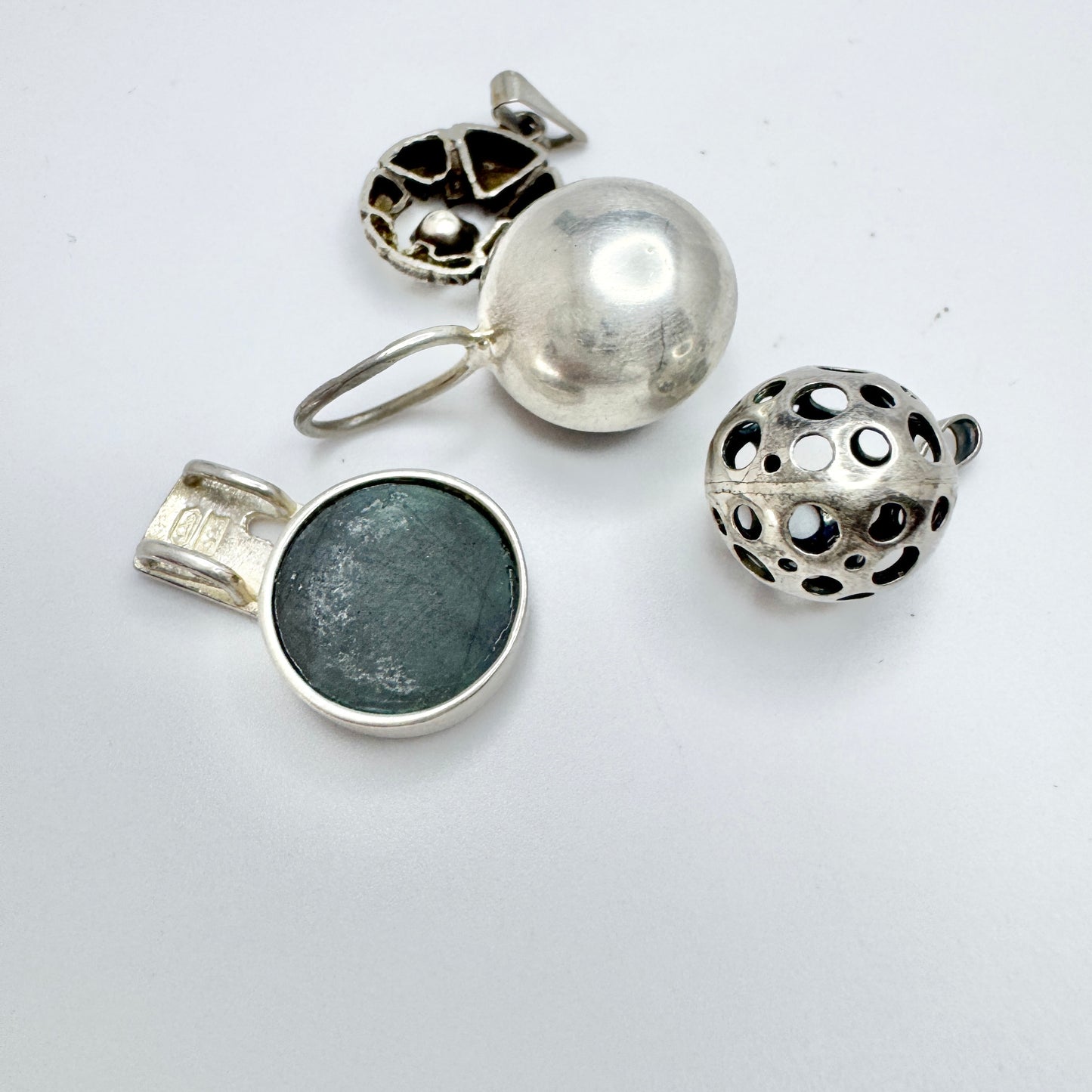 Finland. Four Small Vintage Solid Silver Pendants.