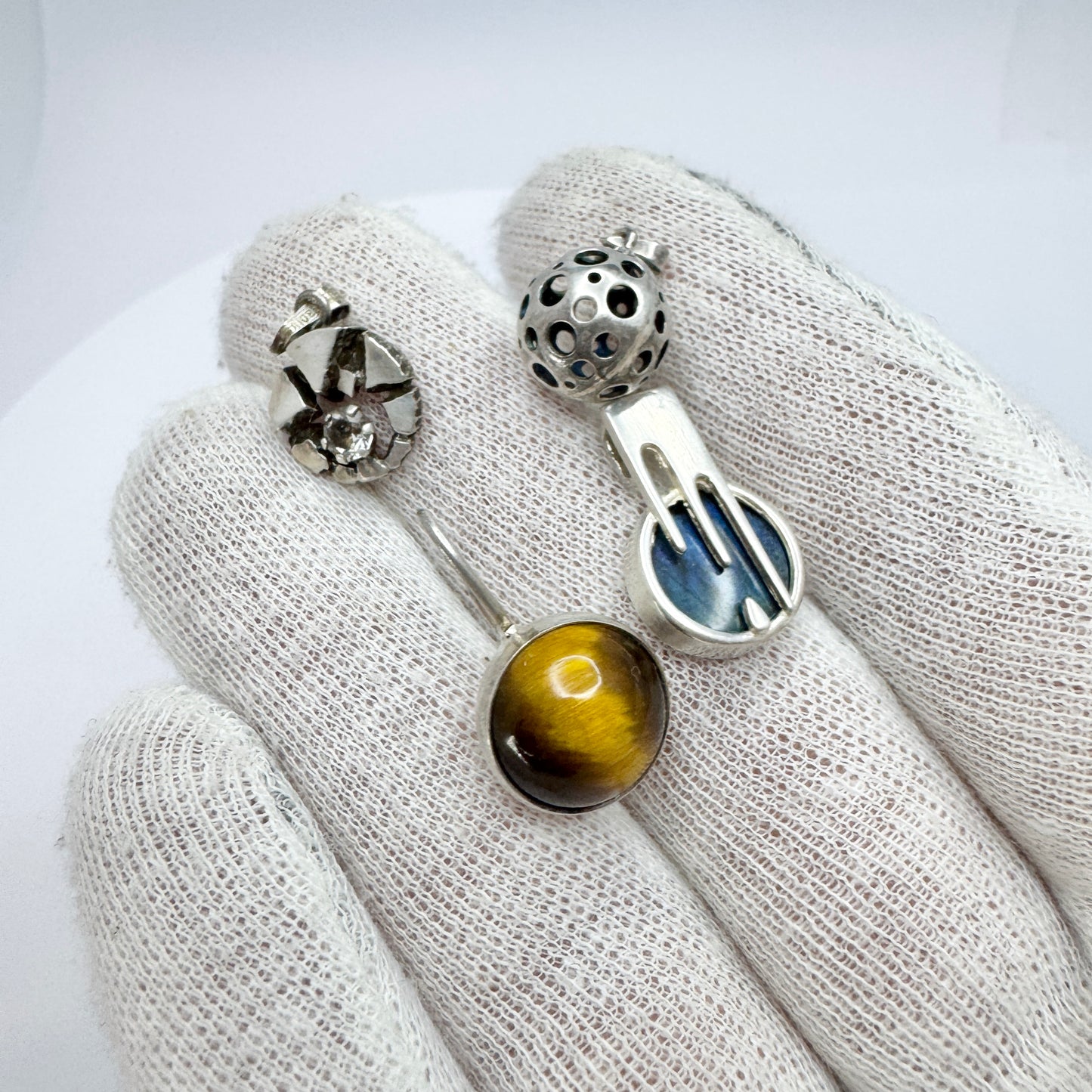 Finland. Four Small Vintage Solid Silver Pendants.