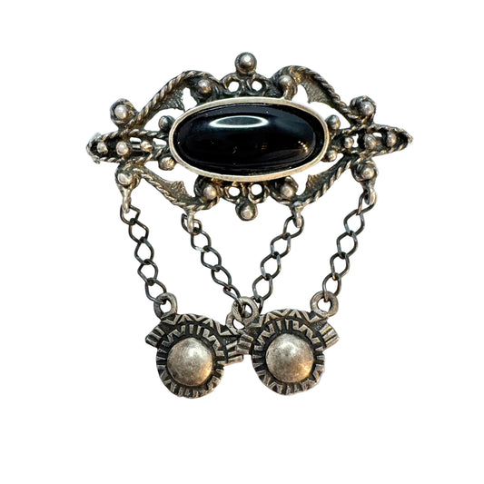 Early to Mid 1900s. Solid Silver Onyx Brooch.