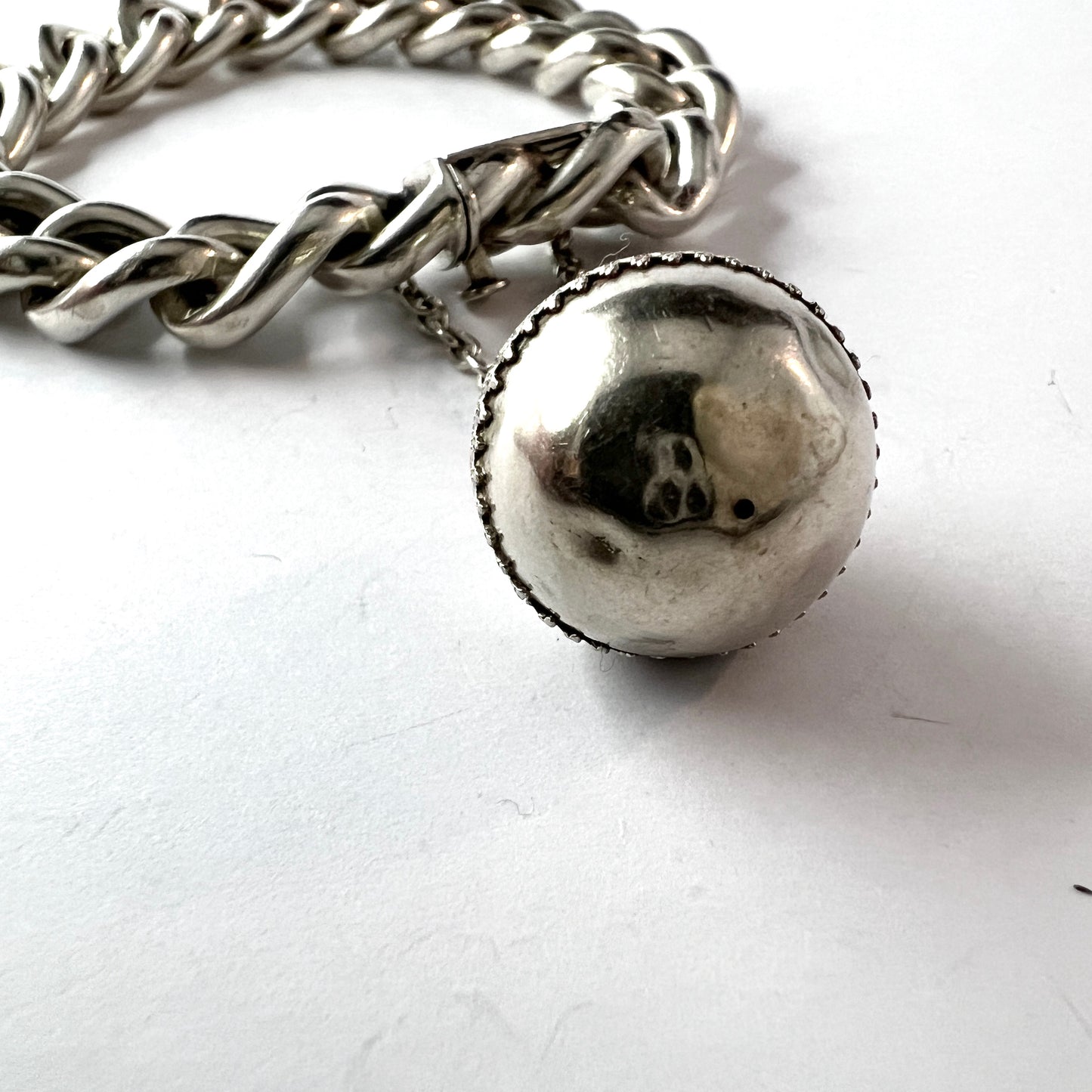 Sweden early 1900s. Antique Memory Silver Bracelet with Troll Ball Charm