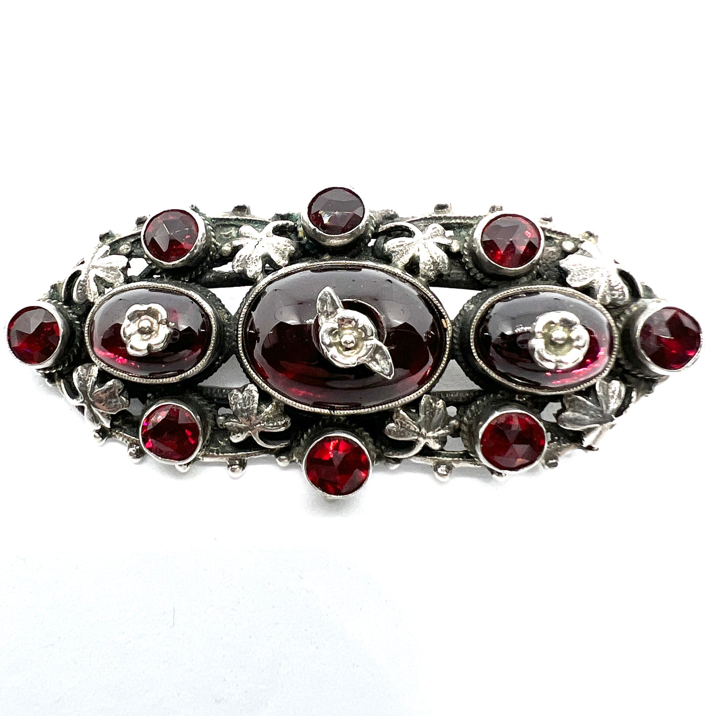 Zoltan White & Co, England c 1920s Arts and Crafts Sterling Silver Garnet Brooch.