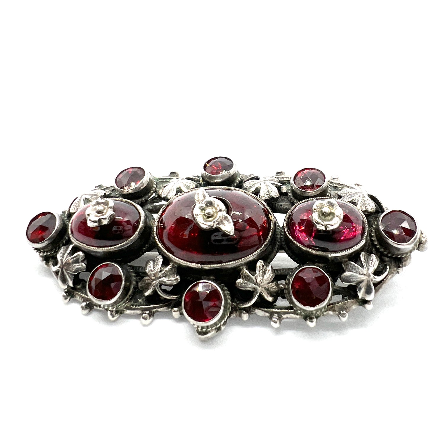 Zoltan White & Co, England c 1920s Arts and Crafts Sterling Silver Garnet Brooch.