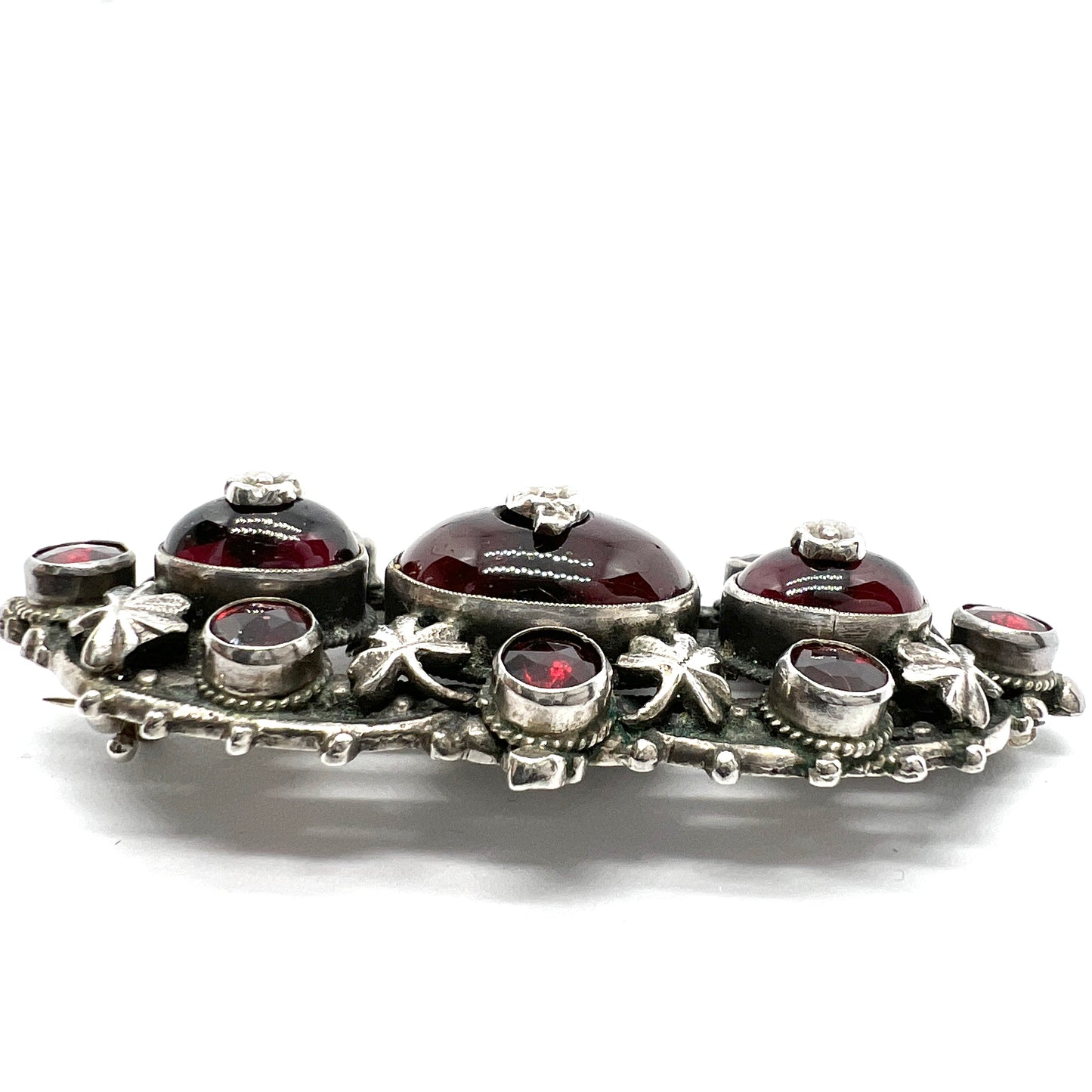 Zoltan White & Co, England c 1920s Arts and Crafts Sterling Silver Garnet Brooch.