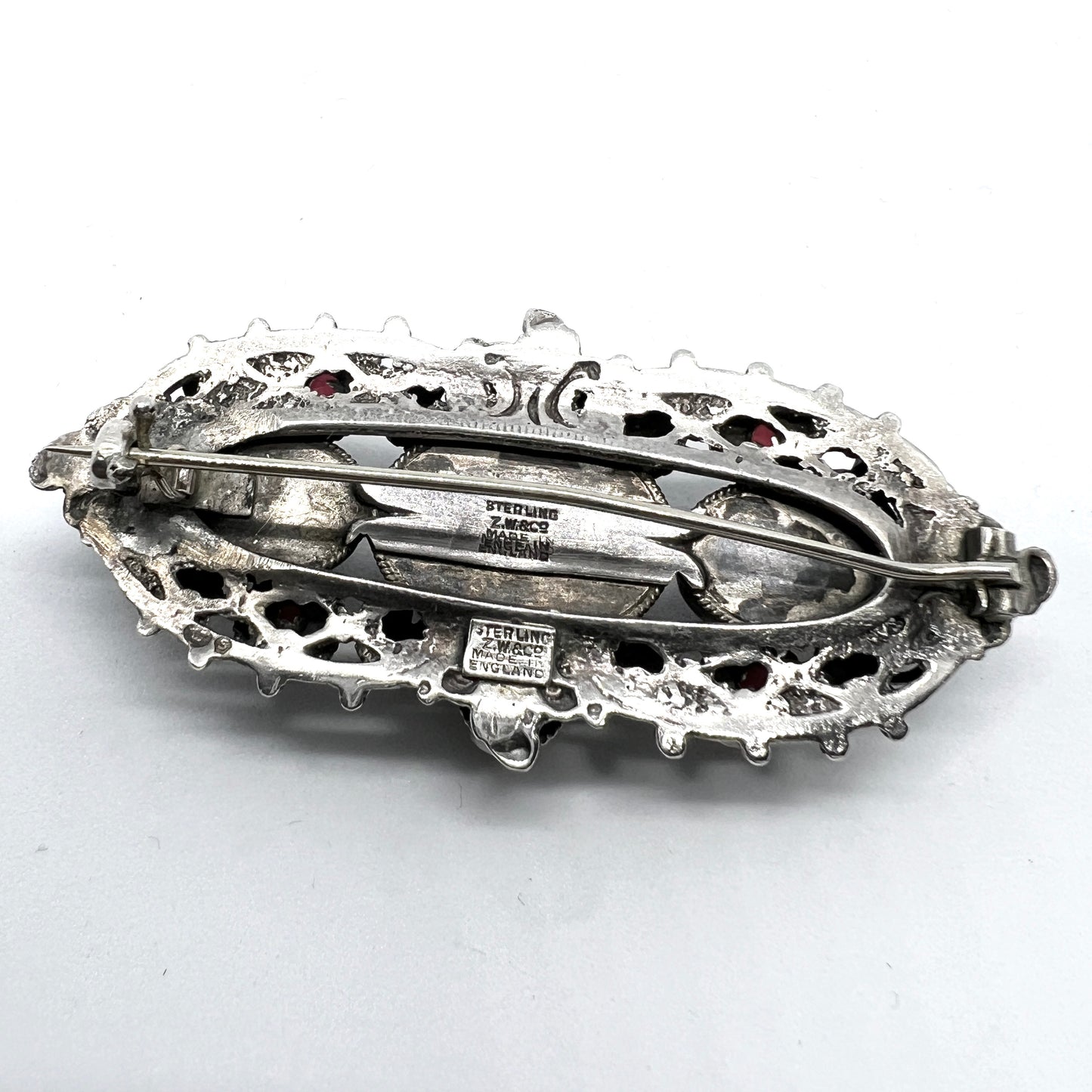 Zoltan White & Co, England c 1920s Arts and Crafts Sterling Silver Garnet Brooch.