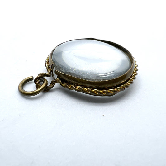 Antique Victorian Pool of Light Locket Pendant. Glass and Yellow Metal.