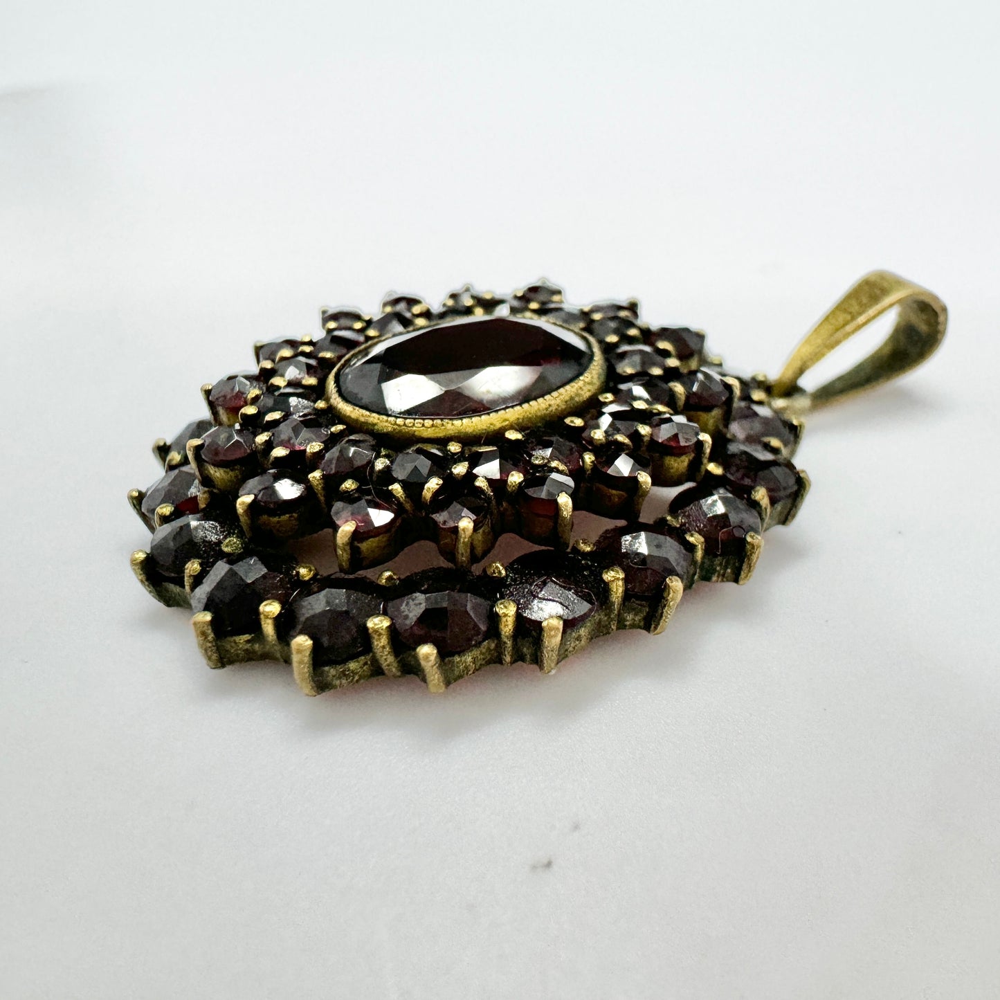 Early 1900s. Vintage Bohemian Garnet Gilt Metal Pendant.