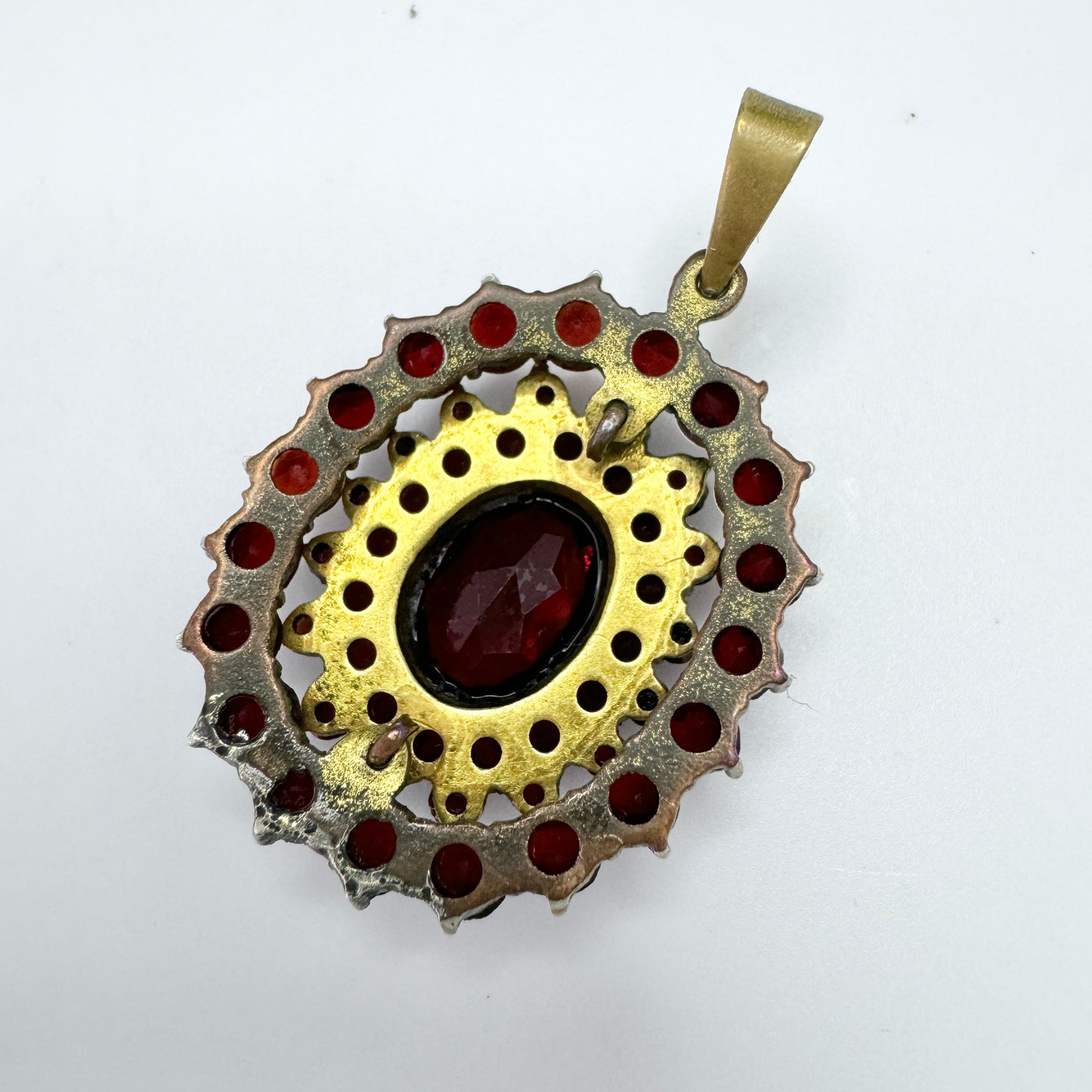 Early 1900s. Vintage Bohemian Garnet Gilt Metal Pendant.