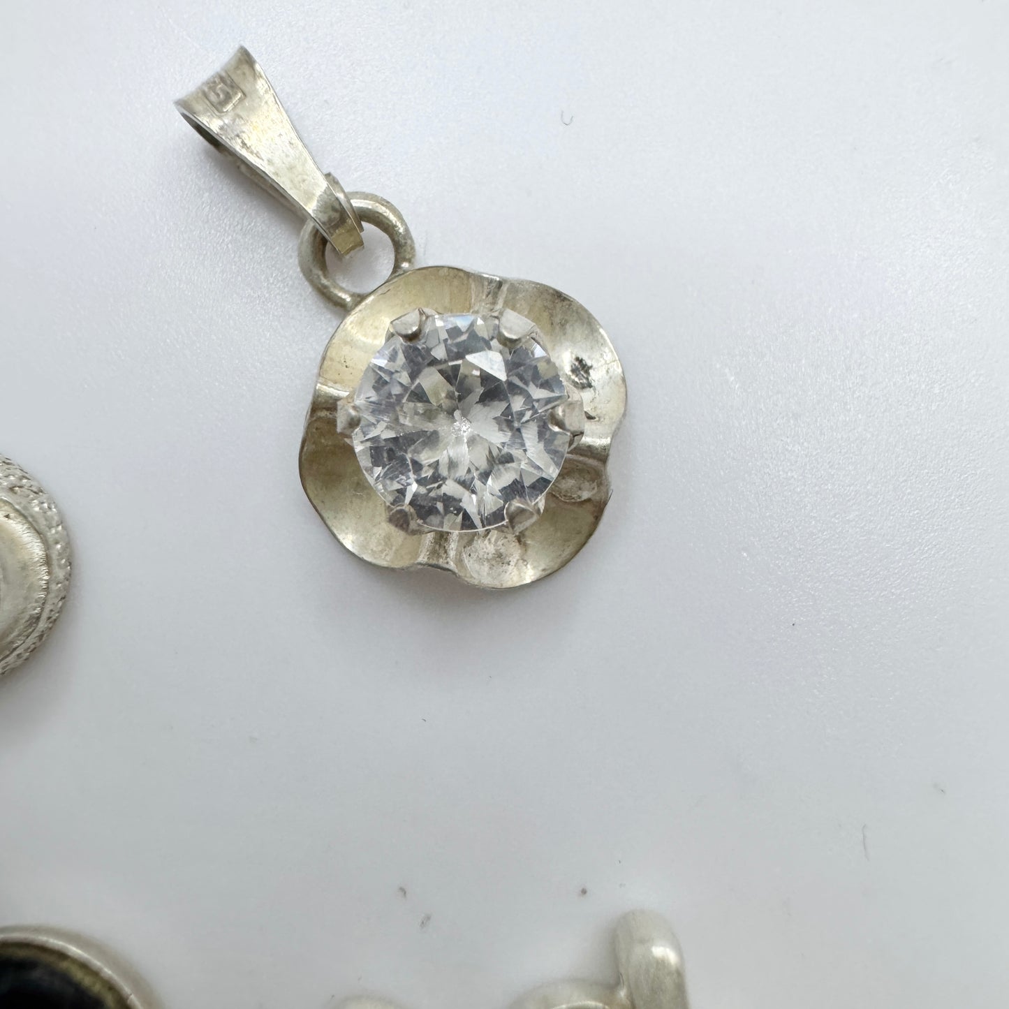 Finland. 4 Small Vintage Solid Silver Pendants.