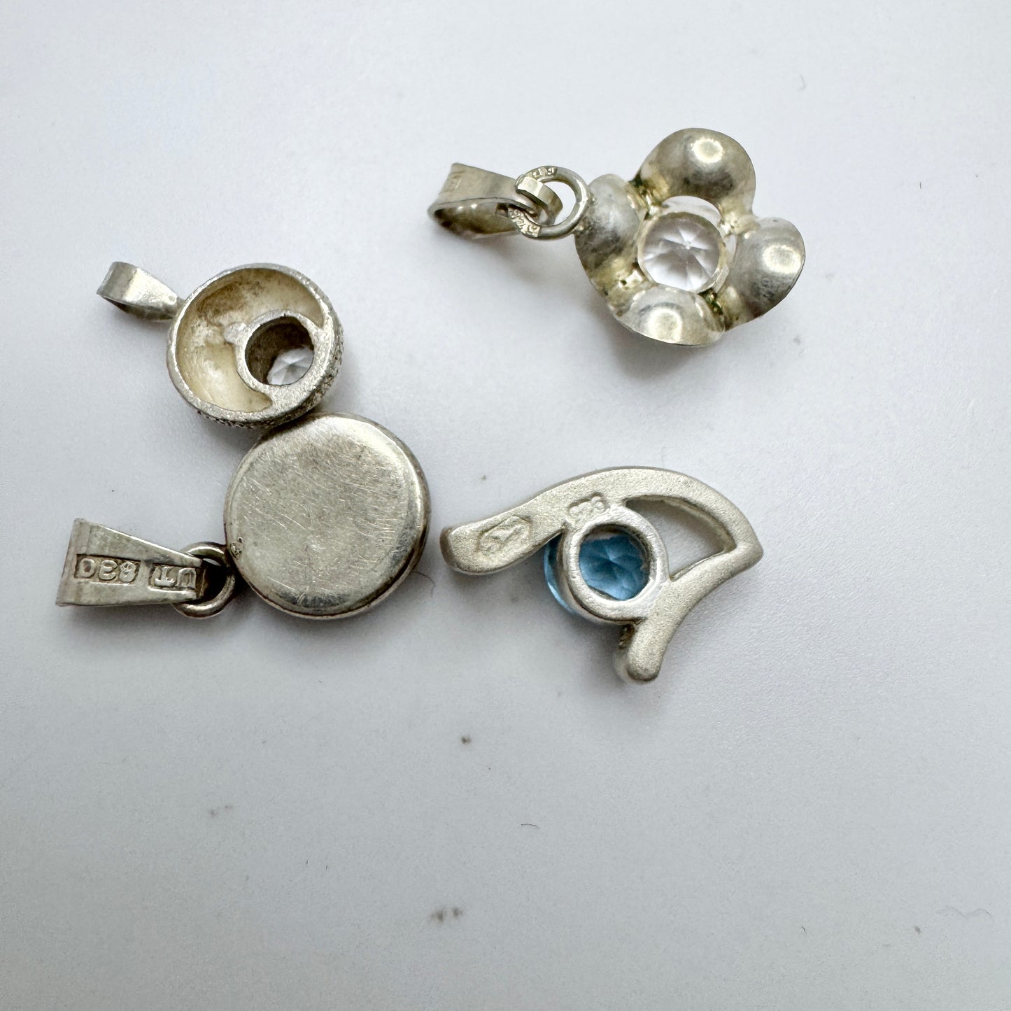 Finland. 4 Small Vintage Solid Silver Pendants.