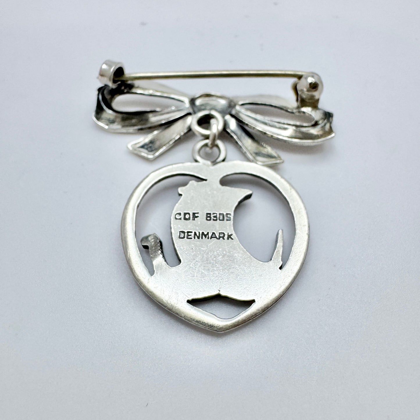 Carl Ove Frydensberg, Denmark 1950s. Vintage Silver Viking-ship Heart Ribbon Brooch.