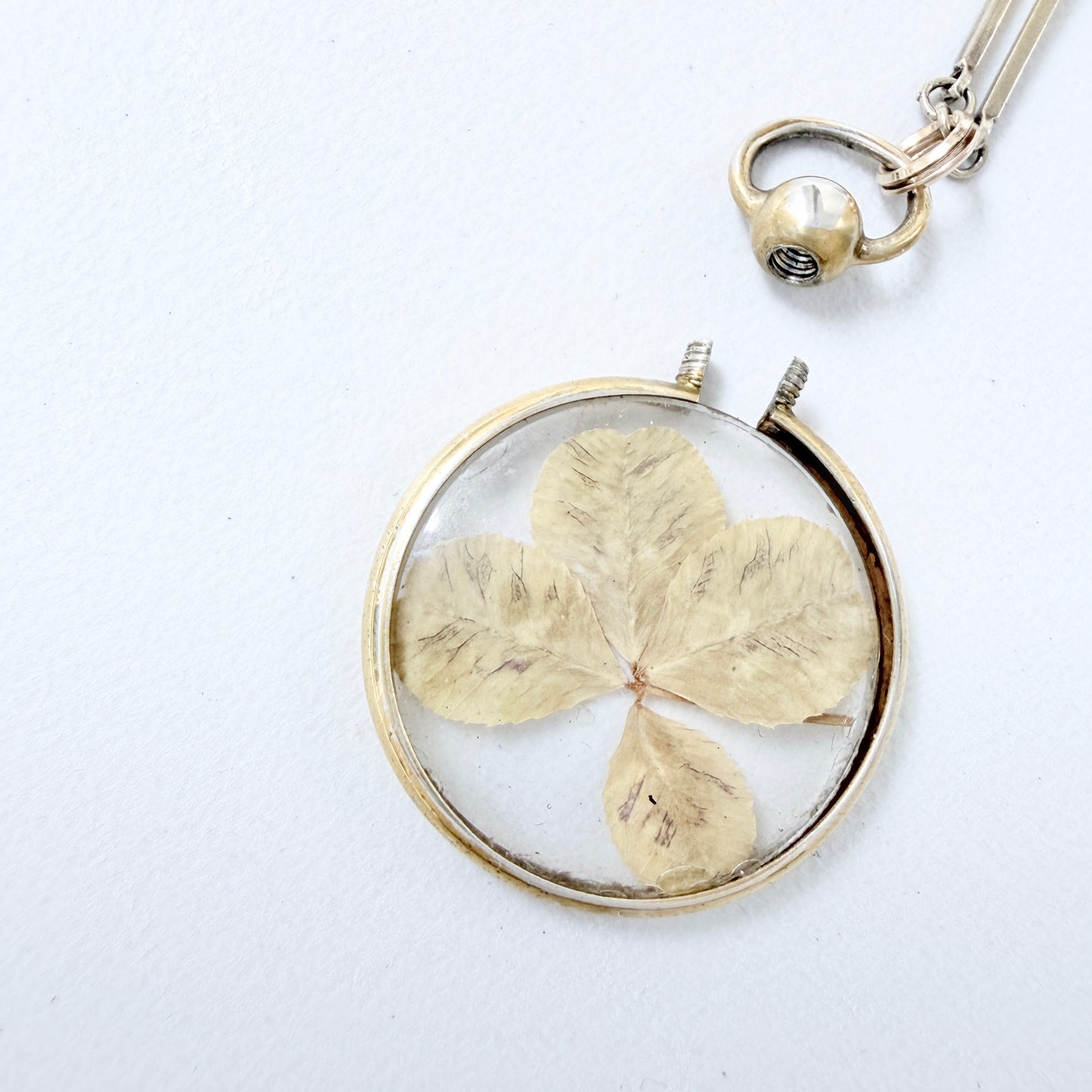 CG Hallberg, Sweden 1913. Antique Silver Four-leaf clover Locket + Long Chain.