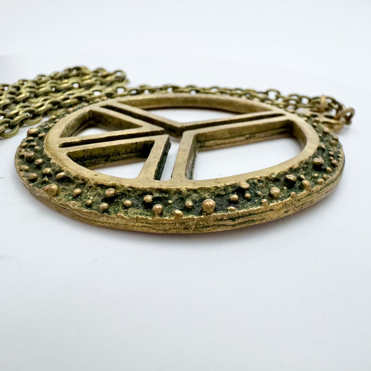 Scandinavia 1970s. Vintage Bronze Hippie Peace Sign Pendant Necklace.