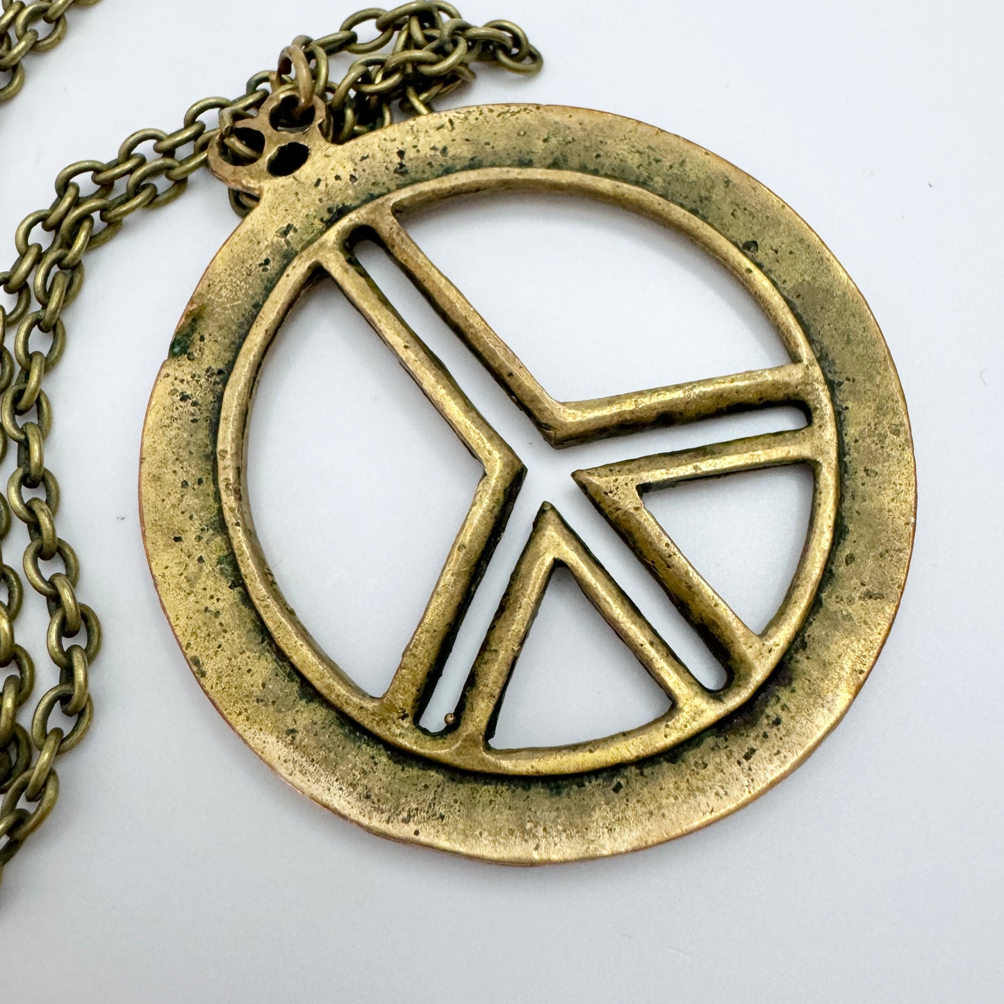 Scandinavia 1970s. Vintage Bronze Hippie Peace Sign Pendant Necklace.