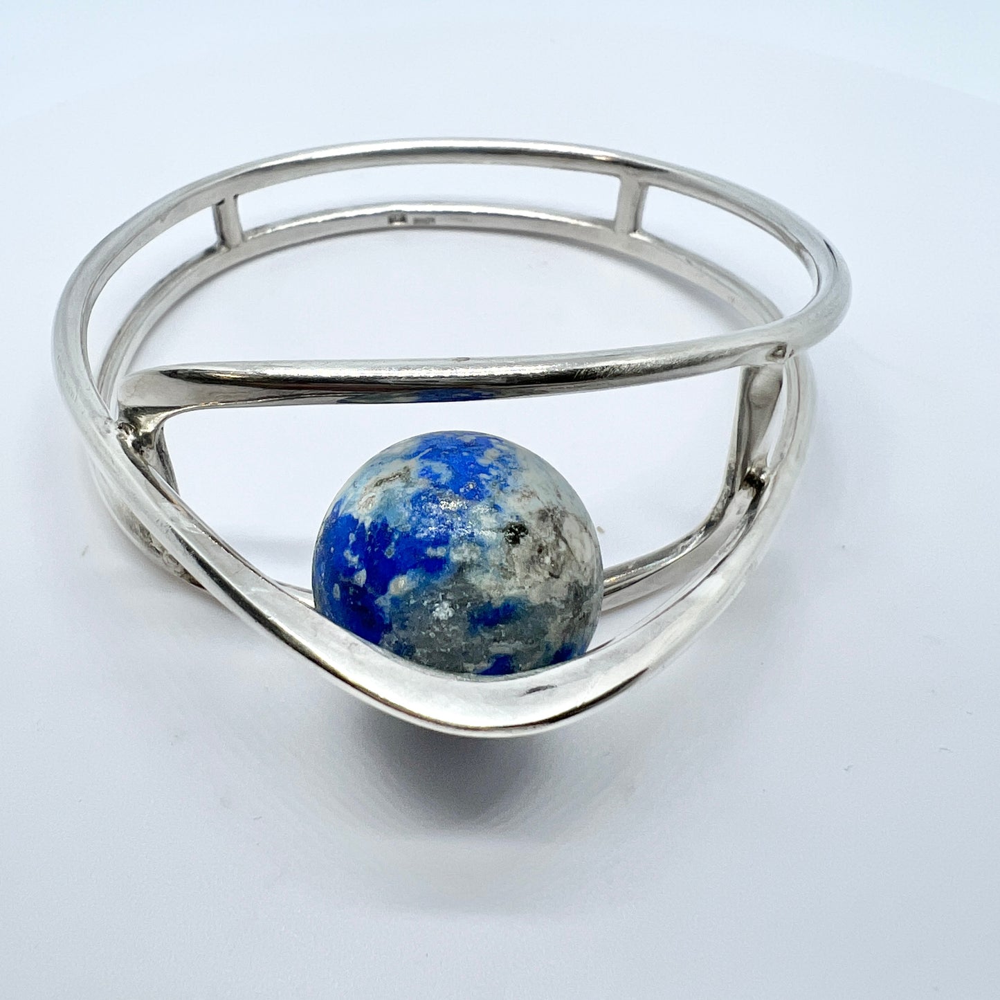 Germany/Austria 1960s. Solid 900 Silver Caged Kinetic Sodalite Ball Bangle Bracelet. Makers Mark.