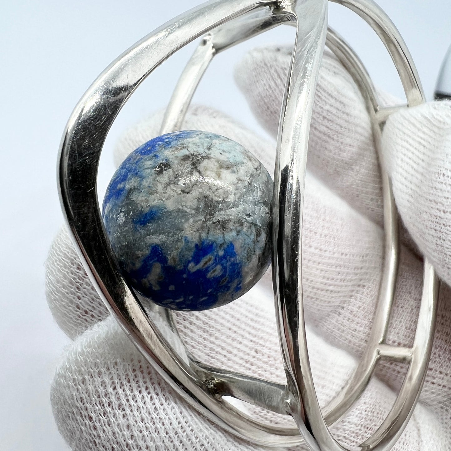 Germany/Austria 1960s. Solid 900 Silver Caged Kinetic Sodalite Ball Bangle Bracelet. Makers Mark.