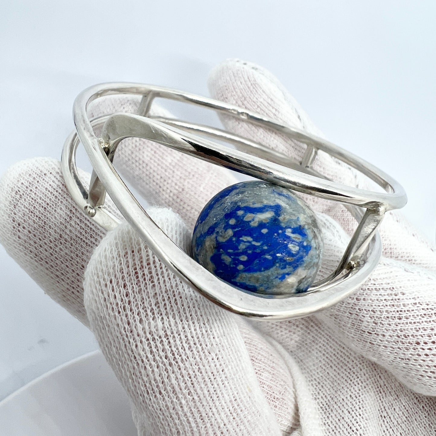 Germany/Austria 1960s. Solid 900 Silver Caged Kinetic Sodalite Ball Bangle Bracelet. Makers Mark.