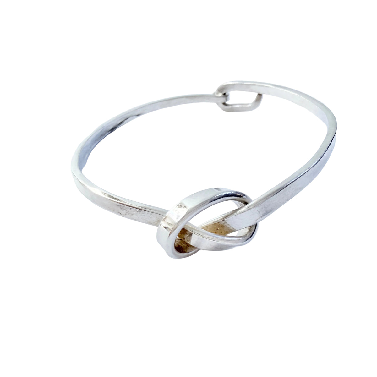 Dan Smedman, Sweden. Hand-wrought Sterling Silver Love Knot Bangle Bracelet.