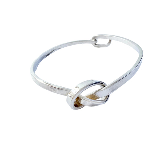 Dan Smedman, Sweden. Hand-wrought Sterling Silver Love Knot Bangle Bracelet.