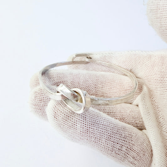 Dan Smedman, Sweden. Hand-wrought Sterling Silver Love Knot Bangle Bracelet.