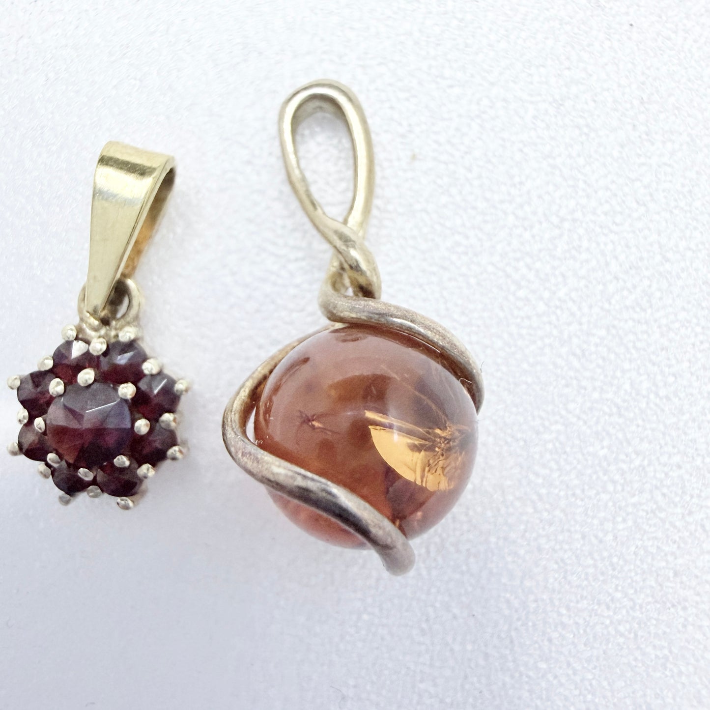 Two Vintage Small Sterling Silver Pendants. Garnets and Amber.