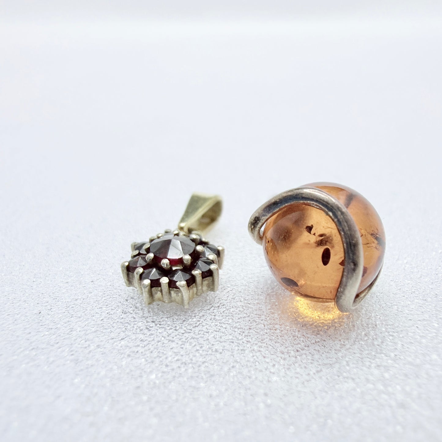 Two Vintage Small Sterling Silver Pendants. Garnets and Amber.