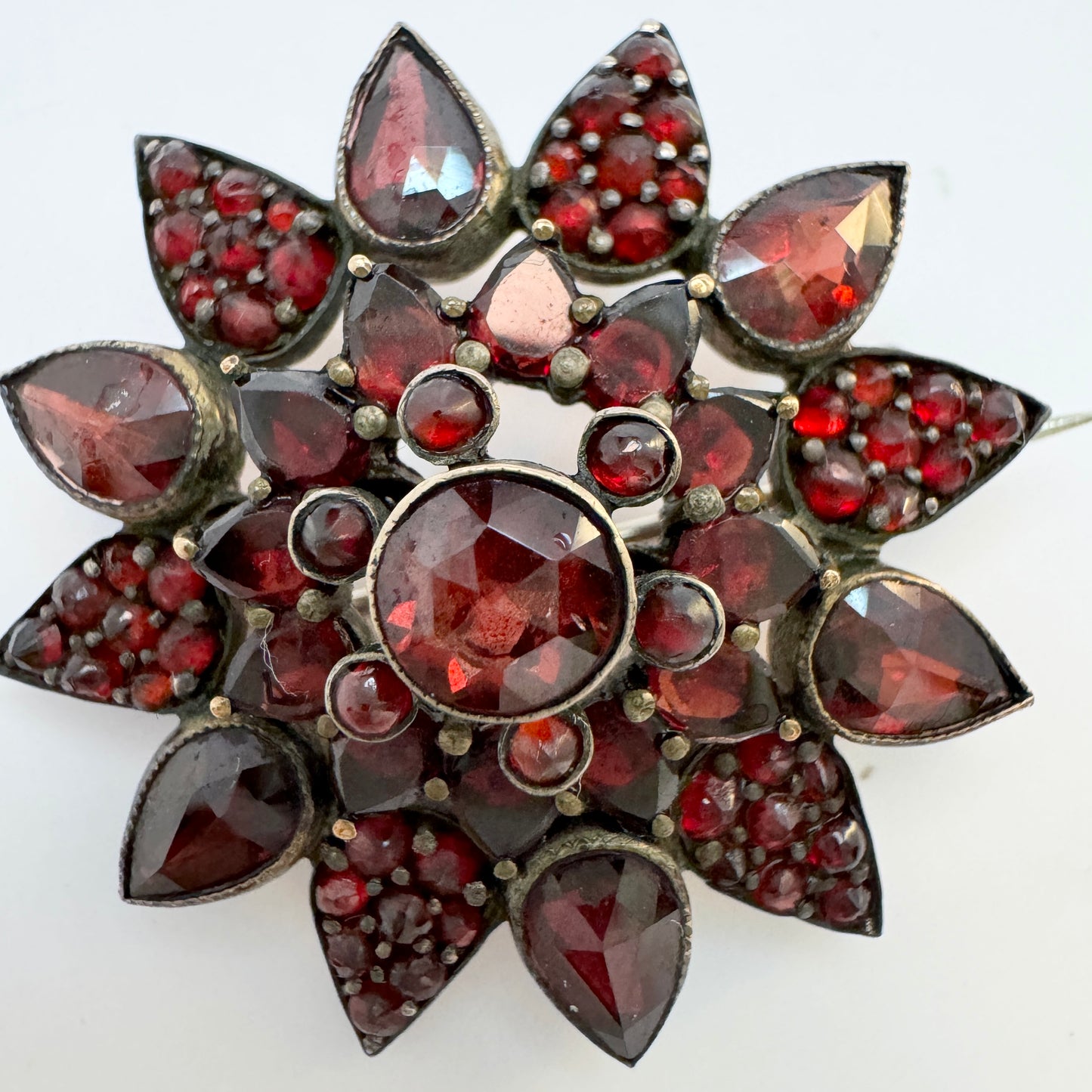 Early 1900s. Vintage Bohemian Garnet Gilt Metal Brooch.