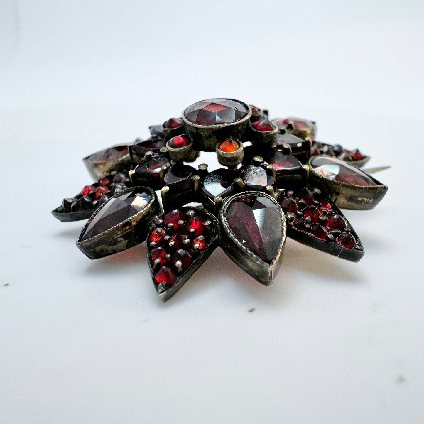 Early 1900s. Vintage Bohemian Garnet Gilt Metal Brooch.