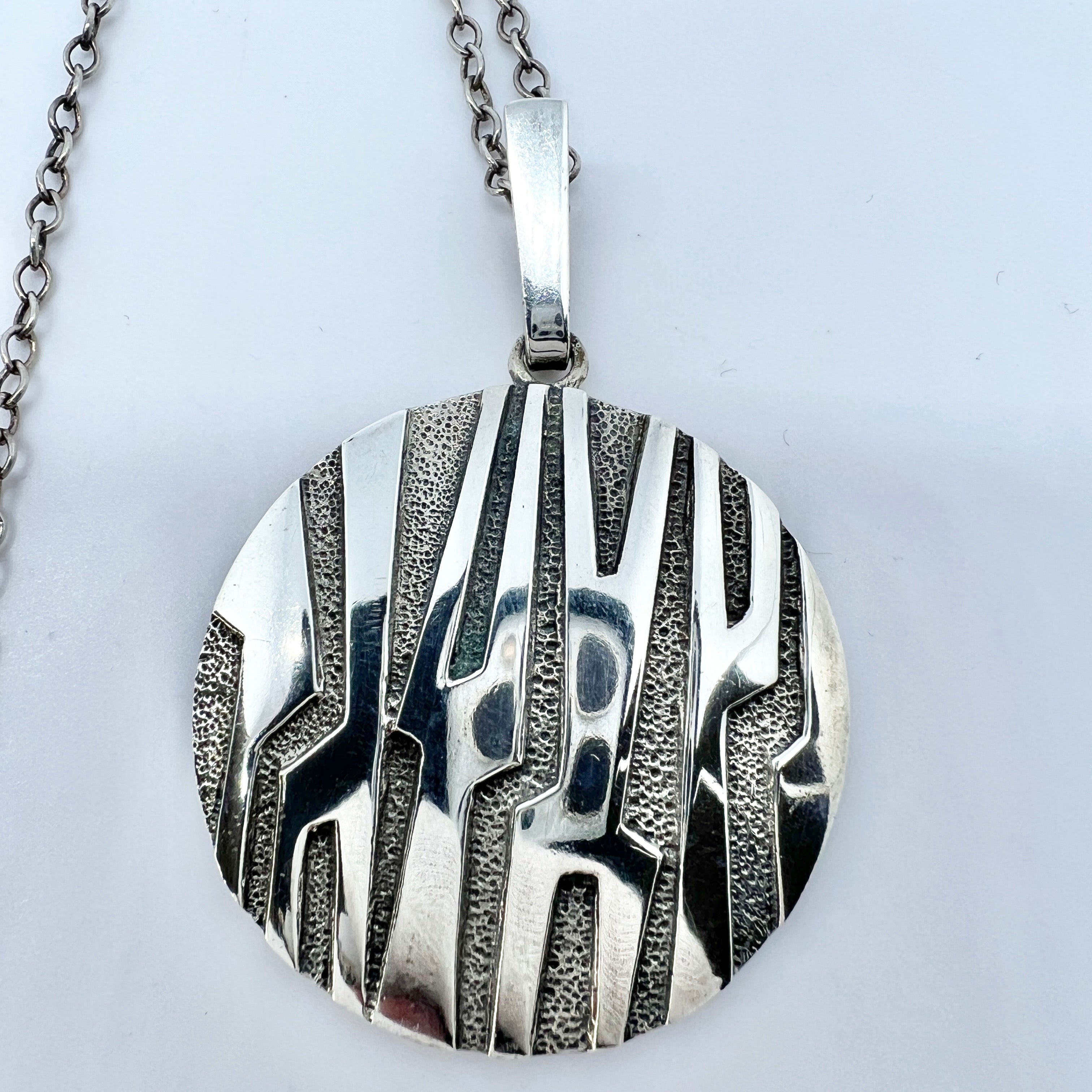 Modernist silver pendant on a chain. 60's. on sale