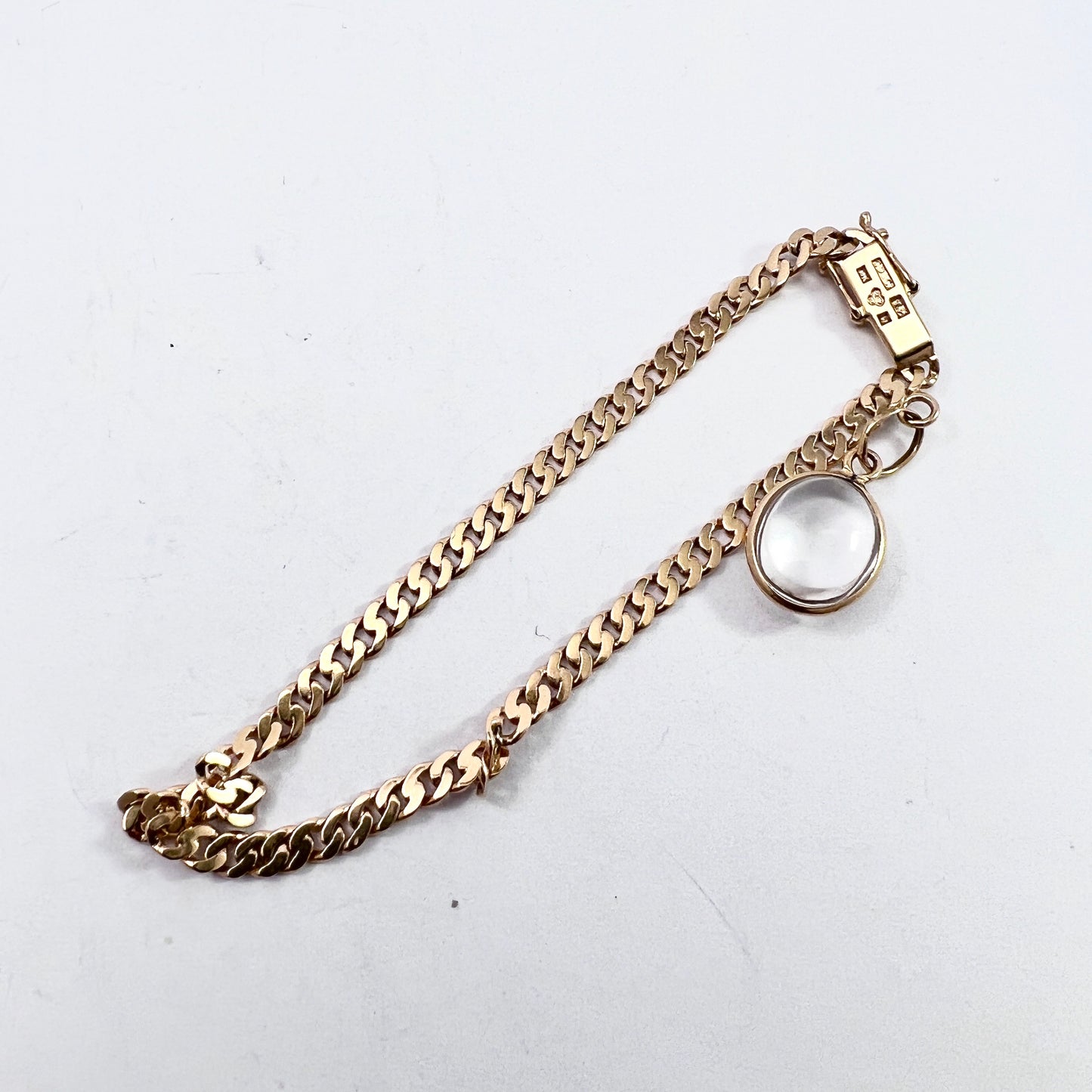 G Dahlgren, Sweden 1945. Vintage 18k Gold Original Pool of Light Rock Crystal Charm Bracelet.