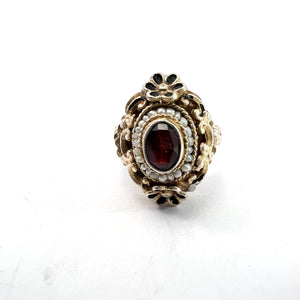 Austria-Hungary early 1900s. Antique Arts and Crafts Gilt 830 Silver Garnet Seed Pearl Enamel Ring.