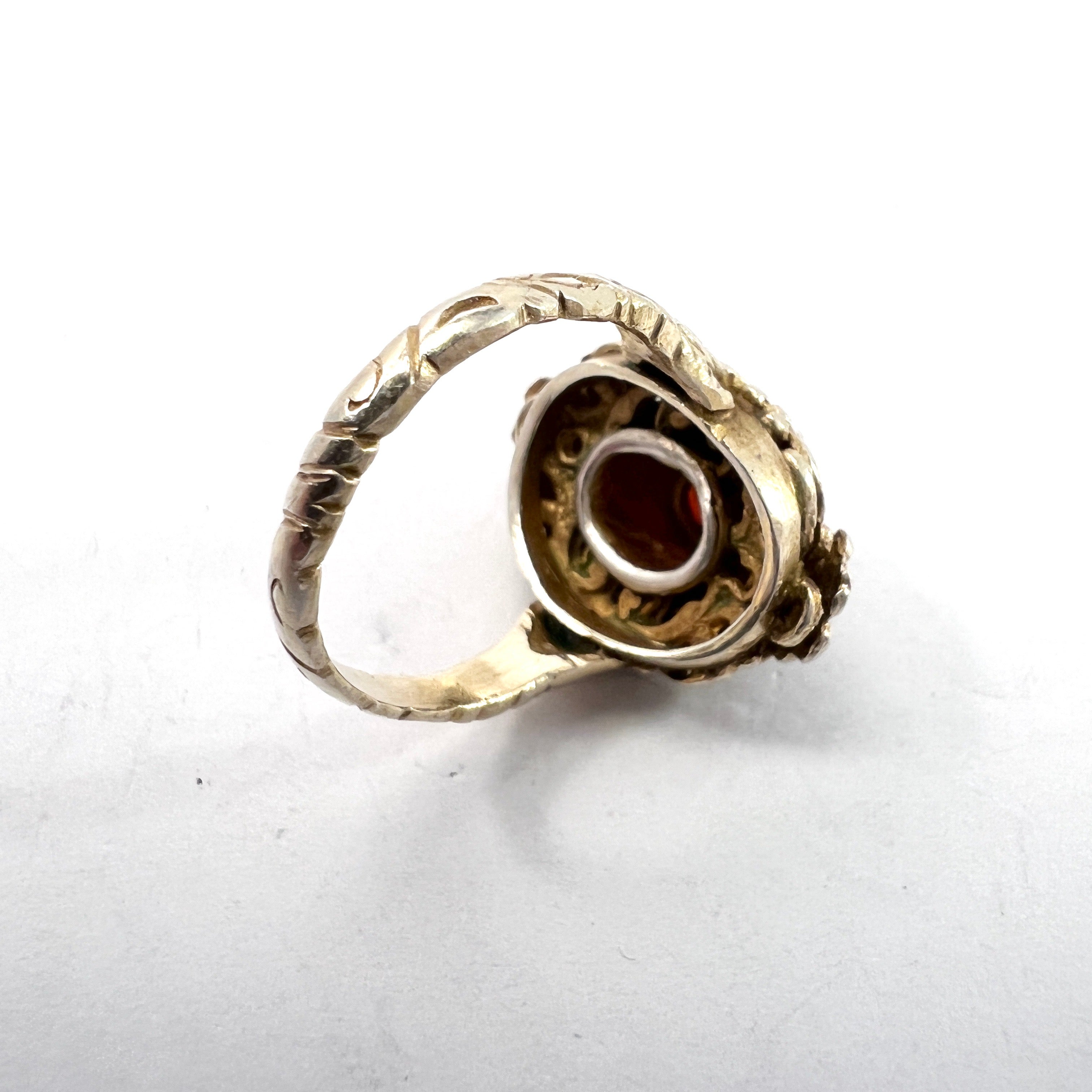Austria-Hungary early 1900s. Antique Arts and Crafts Gilt 830 Silver Garnet Seed Pearl Enamel Ring.