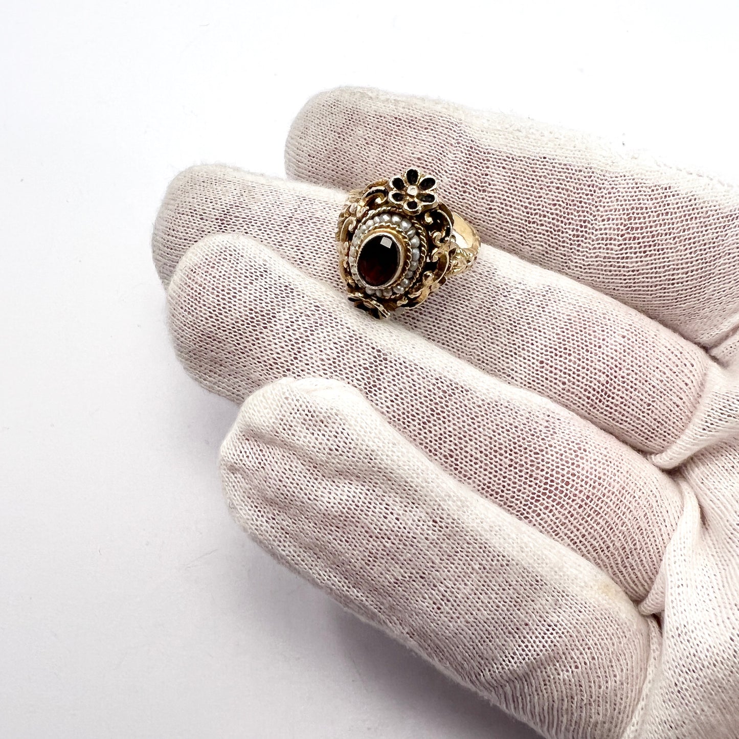 Austria-Hungary early 1900s. Antique Arts and Crafts Gilt 830 Silver Garnet Seed Pearl Enamel Ring.