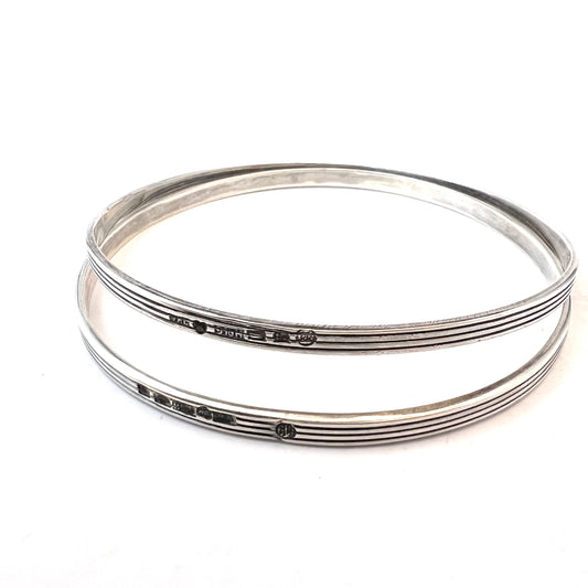 Veikko Kullervo Reinikka, for Kalevala Koru, Finland 1964 Pair of Silver Bangles.