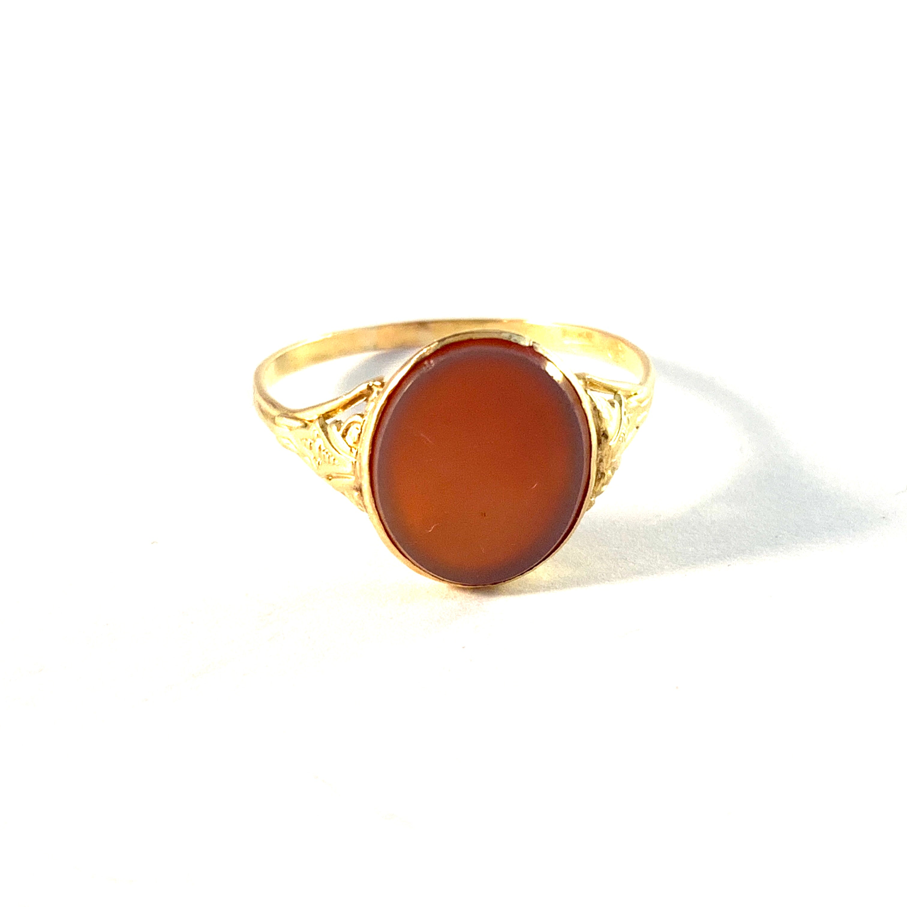 Early to mid 1900s. 18k Gold Carnelian Signet Ring.