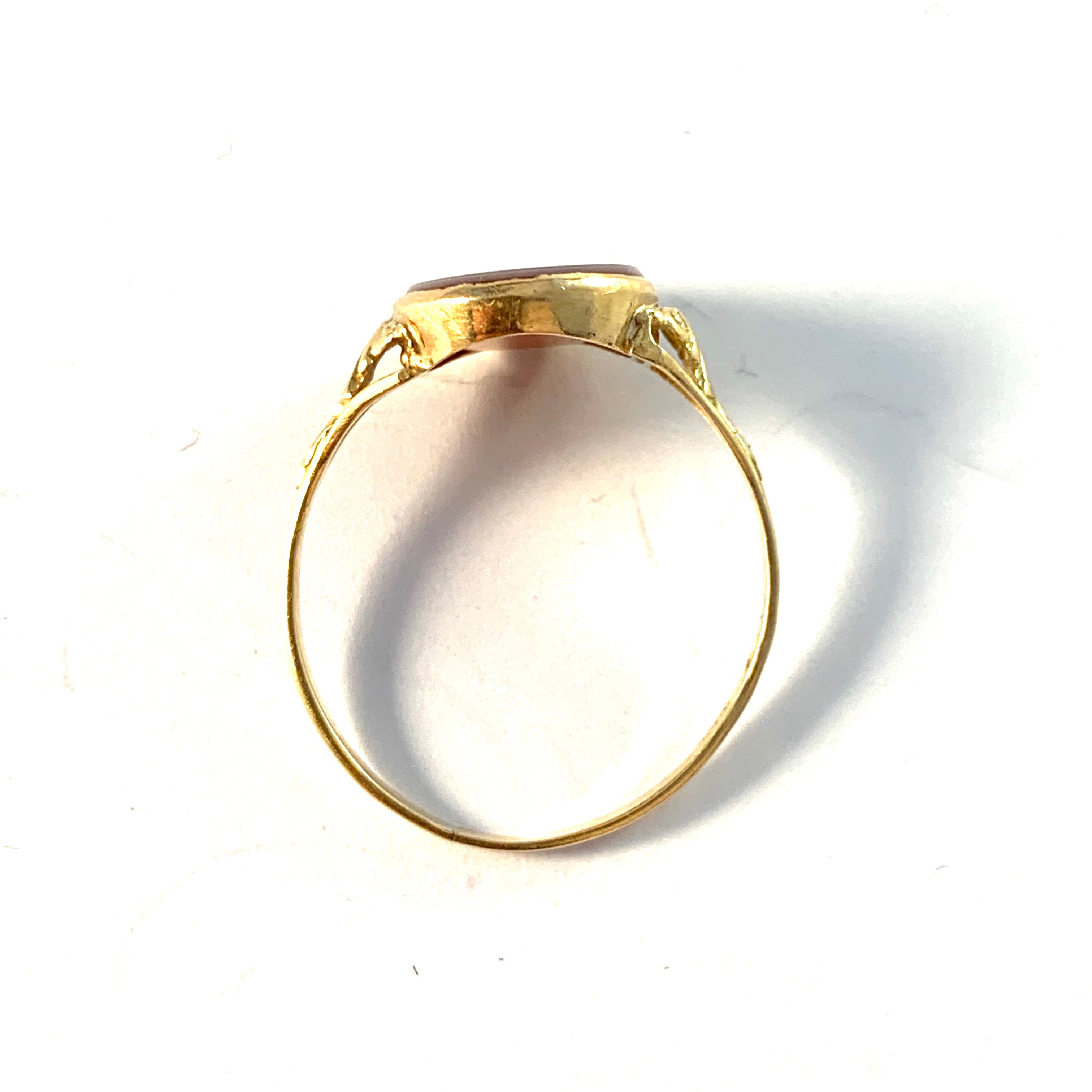 Early to mid 1900s. 18k Gold Carnelian Signet Ring.